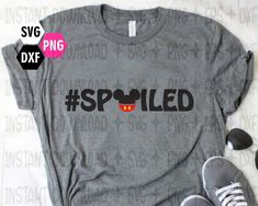 a t - shirt with the words spoiled on it and a pair of sneakers next to it