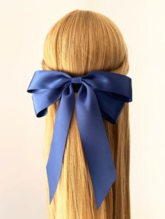 "Gorgeous Navy Satin Long Tail Bow Clip. This listing is for a beautiful velvet bow made with premium satin ribbons. Approx 8.1\" long and 8\" wide.  The bow is hand tied and then attached to a an alligator clip with a secure fit.  Follow blossom and cherry (@blossomandcherry) on Instagram for regular offers and discounts. l All my items are hand made from start to finish with great detail and to a very high standard. I hand cut my bows using mostly my own hand drawn templates.  Production time Satin Hair Bow, Bow Hair Clip, Satin Ribbons, Bow Clip, Velvet Bow, Bow Hair, Long Tail, Satin Bow, Bow Hair Clips