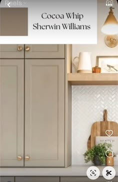 an image of a kitchen with white cabinets and wood counter tops on the phone screen