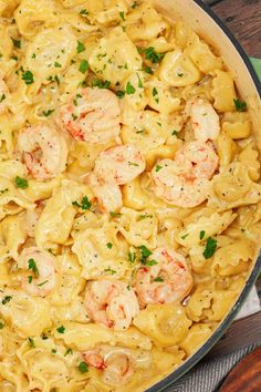 pasta with shrimp and cheese in a skillet