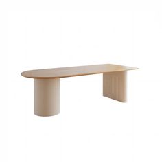 an oval wooden table sitting on top of a white wall