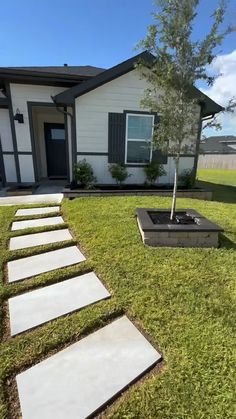 a house that has some steps in the grass