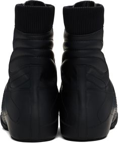 Mid-calf rubberized calfskin boots in black. · Topstitching throughout · Rubber cap toe · Lace-up closure · Logo patch at tongue · Rib-knit collar · Padded jersey lining · Covered platform midsole · Treaded rubber sole · Platform: H2 Supplier color: Noir Leather High-top Sneakers For Winter Streetwear, Designer Boots With Rubber Sole For Streetwear, High-top Winter Boots With Rubber Toe Cap, High-top Boots With Rubber Toe Cap For Winter, Winter Leather High-top Sneakers With Rubber Sole, Black Calf Leather Boots With Moc Toe, Black Moto Boots With Vibram Sole For Winter, Black Moc Toe Boots In Calf Leather, Winter Black Moto Boots With Vibram Sole