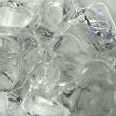 ice cubes in a glass bowl with water