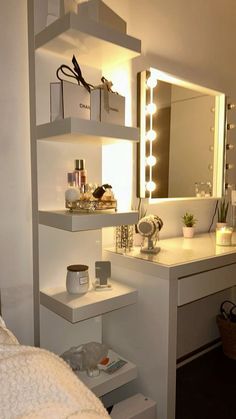 a bedroom with a vanity, mirror and lights