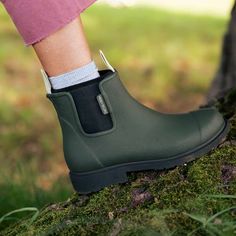 The perfect everyday rain boot. The Bobbi seamlessly blends fashion and function with natural rubber and a neoprene lining. Our best-selling boots are designed for utmost comfort. Easy to dress up or down, wear from day to night, the Bobbi comes in a range of colors to match your style and individuality. Ankle Rain Boots Outfit, Merry People, Alpine Green, Oil Body Wash, Ankle Rain Boots, Wellington Boot, Wellington Boots, Rain Or Shine, Black Accessories