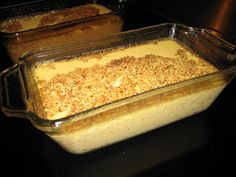 two casserole dishes sitting on top of a stove with food in the bottom