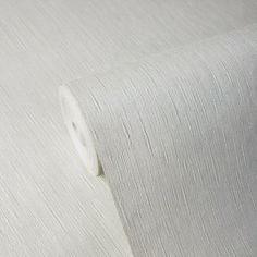 a roll of white paper on top of a table