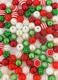 red, green and white bead mix with christmas decorations on the bottom one side