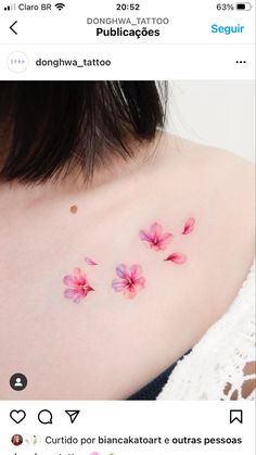 the back of a woman's shoulder with pink flowers on her left arm and chest