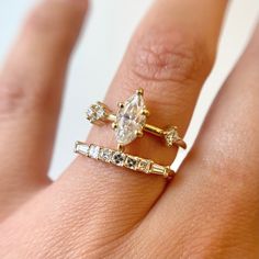 Step back in time with this new band by San Francisco-based Porter Gulch. Featuring a glittering row of asscher cut white diamonds flanked by two tapered baguettes, the Constance is an Art Deco lover's dream. Pair it with an engagement ring or add it to any ring stack that needs a touch of sparkle. Made in San Francisco. 14 karat gold with five asscher cut white diamonds and two tapered baguette white diamonds totaling approximately 0.37 carats (SI1+ clarity, G/H color). Luxury Marquise Diamond Ring With Baguette Diamonds, Timeless Marquise-cut Wedding Ring With Diamond Accents, Heirloom Marquise Diamond Ring With Vs Clarity, Timeless Baguette Cut Diamond Ring With Vvs Clarity, Timeless Baguette Diamond Promise Ring, Timeless Asscher Cut Diamond Wedding Rings, Heirloom Moissanite Ring With Baguette Cut, Heirloom Moissanite Baguette Cut Rings, Heirloom Baguette Cut Moissanite Rings