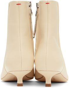 Ankle-high LWG-certified grained nappa leather boots in off-white. · Pointed toe · Zip closure at inner side · Red stitch at heel tab · Grained lambskin lining · Kitten heel with rubber injection · Nubuck sole with rubber injection · Heel: H1.25 Supplier color: Creamy Beige Calf Leather Boots With Reinforced Heel, Cream Leather High Ankle Boots, High Ankle Cream Leather Boots, Beige Calf Leather Boots With Sculpted Heel, Modern Beige Calf Leather Boots, Cream Leather Boots With Sculpted Heel, Cream Leather Heeled Boots With Sculpted Heel, Cream Ankle Boots With Sculpted Heel, Cream Calf Leather Boots With Reinforced Heel