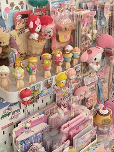 there are many toys on display in the store, including teddy bears and other items