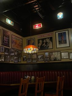 an empty restaurant with pictures on the wall