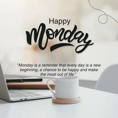 a laptop computer sitting on top of a white table next to a cup of coffee