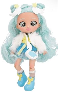 a doll with long blue hair and white fur on it's head, standing next to a growth chart