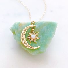 "DESCRIPTION: The AURORA Necklace - Gold crescent moon + opal sun pendant on a dainty gold filled chain. Wear it on its own for a celestial statement or layer it up with your favorite necklaces, either way your going to want to wear this beauty again and again. We love this celestial necklace and think you will too! MATERIALS: Chain, clasp, and jump rings - Gold filled Pendant - Gold plated, Opal, CZ stones PENDANT SIZE: Approximately 1\" in length PACKAGING: Your necklace will arrive on a Daint Aurora Necklace, Opal Moon Necklace, Silver Jewelry Cleaner, Sun And Moon Necklace, Necklace Moon, Necklace Opal, White Jewelry Box, Sun Pendant, Celestial Necklace