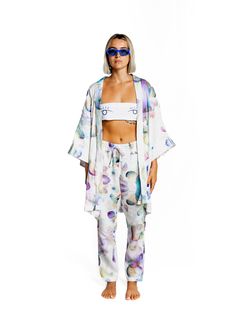 Be Like Water Kimono - Handcrafted Wearable Art Rock your summer boat in effortless elegance wearing the Be Like Water kimono, designed by German artist Ole Ukena and hand-produced by his studio team in Ubud, Bali. This delicate piece is part of Ole's watercolor series, where each design is scanned and printed to create beautiful, flowing colors that blend seamlessly into each other, just like the shapes and forms in the artwork. Crafted with Care Each kimono is a labor of love, created with the Casual Silk Kimono For Summer, Casual Silk Kimono For Spring, Casual Silk Spring Kimono, Summer Silk Wrap Kimono, Casual Summer Kimono For Daywear, Summer White Silk Kimono, White Silk Kimono For Summer, Summer Multicolor Silk Kimono, Artistic Summer Kimono