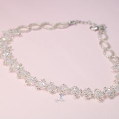 This white crystal bead choker is perfect for cocktail party outfit, wedding party, features shiny white bead with adjustable chain. Add this white rhinestone choker to your everyday fashion jewelry collection or as gift for your love one. Choker length: 13 +2 inches Materials: beads Jewelry Care: See more information about how to care for your jewelry here. Shipping Policy: Orders will be shipped within 1-3 business days. Economy shipping will take 7-14 days to arrive and standard shipping is 1 White Crystal Necklaces With Rhinestones For Party, White Crystal Necklace With Rhinestones For Party, White Adjustable Chain Choker For Party, Crystal Rhinestone Choker Necklace With Sparkling Stones, Crystal Rhinestone Choker With Sparkling Stones, Crystal Rhinestone Sparkling Choker Necklace, Crystal Choker With Sparkling Stones, White Beaded Necklaces With Adjustable Chain For Party, White Beaded Necklace With Adjustable Chain For Party