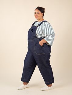 Inspired by vintage work-wear, Jenny is a modern interpretation of classic overalls and wide-leg trousers with an ultra-high rise, sleek, functional details and a comfortable all-day-long fit. Make a more sophisticated version of dungarees with our well-proportioned bib and optional utility pocket, or omit the bib entirely and make a pair of wide-legged cropped pants, full-length pants or shorts. Optional details abound; mix and match the curved slash front pockets, faux fly front, single or dou Utility Overalls With Belt Loops For Workwear, Cotton Overalls With Belt Loops For Work, Straight Leg Denim Jumpsuit With Pockets For Work, High Waist Relaxed Fit Overalls For Workwear, Bib Front Overalls With Pockets For Workwear, Utility Style Bib Front Bottoms For Workwear, Utility Bib Front Bottoms For Workwear, Workwear Overalls With Bib Front And Pockets, Relaxed Fit Denim Jumpsuit For Work