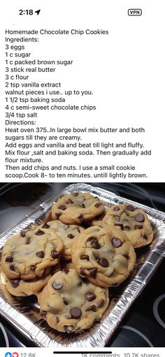 chocolate chip cookies sitting on top of a metal pan next to a cookie sheet with instructions