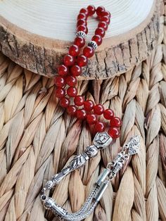 ✔️ This magnificent tasbih made with AA quality 8 mm carnelian agate beads. ✔️ It is a elegant and striking tesbih. ✔️ Natural Color ✔️ Natural Stone ✔️ Each order comes in a special box. ✔️ PLEASE CLICK THE LINK FOR ALL PRAYER BEADS MODELS https://www.etsy.com/shop/GoodJewelsofYazmasal Note: As a natural feature the stones beads may have some variations. SHIPPING: United States (Standart/DHL eCommerce/usps): 7-10 business days United States (Express/FedEx): 3-5 business days Canada (Express/Fed Red Gemstone Beads As Gift, Traditional Carnelian Beads As A Gift, Red Spiritual Beads And Cabochons For Jewelry Making, Red Carnelian Beads For Gift, Red Gemstone Beads For Gifts, Red Carnelian Beads For Gifts, Traditional Red Beaded Bracelets For Healing, Traditional Carnelian Beads For Gift, Traditional Agate Beaded Bracelet Gift