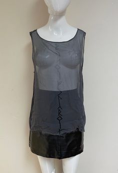 "Stunning wispy sheer grey tank / tunic / blouse by iconic brand Ovate, printed with a protection spell in Runes on the front. Vintage label size is Small but see Approximate Measurements below: this treasure is a loose fitting Small and could fit many Mediums and some Larges.   Gothic / Magick / Thelemic / Witch / Blessing / Spell / Protection / Altar / Ceremony / Pagan  Ovate quickly sold out of this style top many years ago so this is a rare find! It's hard to photograph the Runic letters since the shirt is so sheer but they're not faded out at all.  Gender neutral, of course. 💥Vintage Label: Ovate 💥Vintage Label Size: Small   💥Condition: Excellent vintage condition.  Measurements are taken while the garment is lying flat. Please double where appropriate for actual dimensions. 💥MEAS Sheer Sleeveless Blouse For Spring, Sheer Tank Top For Layering, Sleeveless Mesh Top For Summer Layering, Sheer Mesh Top For Summer Layering, Sheer Tank Top For Summer Layering, Sheer Tank Top For Layering In Spring, Gray Summer Layering Tops, Spring Sheer Tank Top For Layering, Sheer Sleeveless Mesh Top For Layering