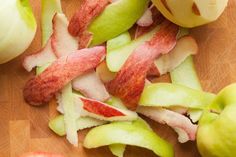 sliced apples are sitting on a cutting board