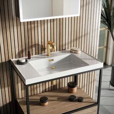 a white sink sitting on top of a wooden counter