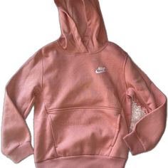 Nike Long Sleeve Hoodie, Nike Hooded Tops With Adjustable Hood, Pink Adjustable Hood Sweatshirt For Spring, Pink Spring Sweatshirt With Adjustable Hood, Spring Pink Sweatshirt With Adjustable Hood, Nike Hoodie For Spring, Pink Nike Tops For Winter, Pink Nike Hoodie With Crew Neck, Nike Pink Winter Tops