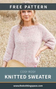 a woman standing in a field with her hands on her hips wearing a knitted sweater