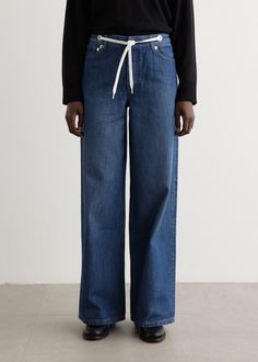 Established in 1987 by fashion designer Jean Touitou, A.P.C. derives from Atelier de Production et de Creation, and is known for its relaxed and minimal approach to design Constructed from cotton, the Madame Wide Jeans showcase a generous leg, elevated waistband, and a fastening combination of drawstring, button, and zipper. The indigo denim provides a loose and fashionable silhouette for a comfy and stylish appearance. - Cotton fabric - High-rise- Waistband with tie contrasting tie closure- Five pocket construction - Zip fly with button closure- Relaxed, wide leg silhouette Materials:100% Cotton. Care:Cold machine wash. Sizing: Item fits true to size. Model wears a size 26 and is 177cm/5'9.5". Jean Touitou, Indigo Denim, Wide Jeans, Designer Jeans, Jeans For Sale, A P, Fashion Designer, Casual Pants, Wide Leg