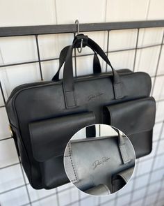 This personalized leather men's briefcase is the ultimate blend of style and functionality, making it an ideal laptop bag and work companion. Crafted from high-quality leather, this black satchel offers a sleek design with ample space for a laptop and other essentials, ensuring you stay organized on the go. Perfect for professionals, this men's shoulder bag is not just a practical accessory but also a thoughtful birthday gift. Its personalized touch adds a unique element, making it a standout pi Black Briefcase With Laptop Sleeve For Work, Black Briefcase With Laptop Sleeve, Black Laptop Sleeve Tote Briefcase, Black Tote Briefcase With Laptop Sleeve, Rectangular Briefcase With Interior Card Slots, Black Laptop Backpack For Office, Black Office Laptop Backpack, Black Standard Backpack Laptop Bag For Office, Everyday Black Laptop Bag