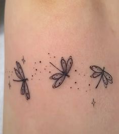 three dragonflys on the back of a woman's thigh