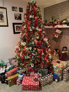 a decorated christmas tree with presents under it