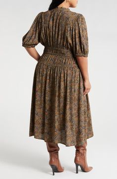 "Find TREASURE & BOND Puff Sleeve Drop Waist Midi Dress on Editorialist. A stretchy, shirred drop waist shapes the silhouette of a '50s-inspired midi dress that amps up the romance with puffy sleeves and a softly ruffled neckline. 50\" length (size 2X) Slips on over head Split neck with ties Short sleeves with smocked cuffs Elastic waist 100% viscose Unlined Machine wash, line dry Imported" Autumn Floral Dress, Spring Midi Dress For Gatherings, Ruched Midi Dress With Fitted Waist, Fall Dresses With Gathered Skirt, Knee-length Floral Midi Dress With Fitted Waist, Fitted Smocked Midi Dress With Gathered Neckline, Spring Gatherings Ruched Midi Dress, Fitted Midi Dress With Smocked Back For Gatherings, Fitted Dress With Gathered Waist For Gatherings