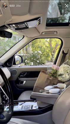 the interior of a car with flowers and gifts