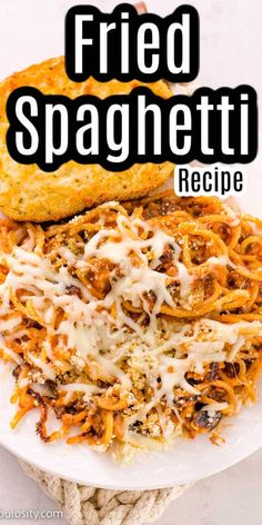 fried spaghetti on a white plate with text overlay that reads fried spaghetti recipe in black and white