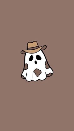 a white and brown cow wearing a hat on top of it's head with black spots