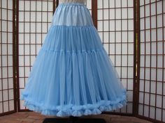 "This listing is for a custom order for a super-full double layer nylon chiffon petticoat with satin waist. If you like sultry swaying skirts, then this is the petticoat for you ;) The chiffon fabric hangs heavy so it causes this petticoat to drape and flow during movement. The pictured petticoat was designed for a 28\" (71cm) waist, 37\" (94cm) hips and is 33.5\" (85cm) long. It is displayed on a dress form with a 22\" (55cm) waist. You can choose any length you need. I will lengthen each of th Fitted Gathered Petticoat For Costume Party, Fitted Summer Petticoat For Prom, Fitted Petticoat With Gathered Skirt For Costume Party, Fitted Organza Skirt With Ruffles, Fitted Full Tulle Skirt Petticoat, Fitted Full Tulle Petticoat, Fitted Organza Petticoat With Ruffles, Fitted Full Skirt Petticoat For Party, Fitted Full Skirt Petticoat For Prom