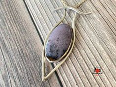 This purple jasper cabochon is surrounded by a delicate framework of .999 Fine Silver. Elegant Jasper Gemstone Jewelry, Elegant Silver Jasper Jewelry, Artisan Jasper Jewelry In Oval Shape, Jasper Cabochon Jewelry Gift, Jasper Cabochon Jewelry For Gifts, Artisan Oval Jasper Jewelry, Cabochon Jasper Jewelry As Gift, Hand Forged Jasper Artisan Jewelry, Artisan Hand Forged Jasper Jewelry