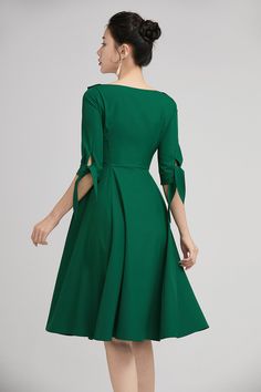 "The green swing dress with lapel collar is made of high quality polyester. The full cut romantic knee-length skirt with pleating details sways gently with every step. The tailored fitted bodice with a hidden side zip, defines the bust and waist. The elbow length sleeves are finished off with tie belt cuff. A row of buttons in the front and the Lapel Collar gives our classic dress timeless vintage charm, striking just the right balance between elegance and comfort. DETAILS * Satiny fabric, conta Plain Skater Dress, Women Dresses Casual Summer, Vintage Midi Dresses, Skater Dresses, Womens Cocktail Dresses, Midi Cocktail Dress, Line Dress, Designs Ideas, Classic Dress