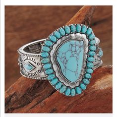 Conchos Around The Band Pop With Faux-Turquoise Stones 21/2" Wide At Center Stretches To Fit Most Wrists Western Style Blue Bangle Jewelry, Adjustable Southwestern Blue Cuff Bracelet, Bohemian Adjustable Concho Bracelets, Adjustable Bohemian Concho Bracelets, Bohemian Adjustable Bracelets With Concho, Western Blue Jewelry For The Beach, Adjustable Southwestern Turquoise Cuff Bracelet, Adjustable Turquoise Western Bracelet, Adjustable Turquoise Southwestern Cuff Bracelet