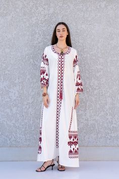 "**Note : The kaftan in the video is a different color of the exact same Kaftan and is only displayed to show the fit, flow, and cut of the Kaftan. You will receive the one in the pictures.** This bohemian embroidered dress is a an eye catcher! It is an extremely comfortable wear, light and soft and can be used on many occasions -  home gatherings, festival parties, summer occasions, dinners, or just in your home to feel comfortable.  Fabric : 70% Egyptian Cotton; 30% Polyester. Small (Size 4/6 White Bohemian Embroidered Gown, Eid Floor-length Kaftan With Chikankari Embroidery, Eid Chikankari Embroidery Floor-length Kaftan, White Bohemian Gown With Intricate Embroidery, Bohemian White Gown With Intricate Embroidery, Floor-length Resham Embroidered Kaftan, Folk Style Embroidered Floor-length Dress, Bohemian Maxi Gown With Resham Embroidery, Bohemian Gown With Resham Embroidery In Maxi Length