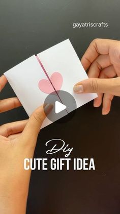 two hands holding up a card with the words diy cute gift idea