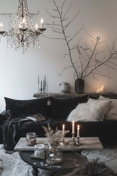 a living room filled with furniture and candles