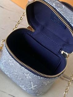 This Micro Vanity handbag is made of Monoglam jacquard canvas, and the exquisite configuration is covered with metallic luster by coating technology. Double zippers open ample interior space, which can accommodate small accompanying items, with a detachable mirror. The top handle and detachable and adjustable shoulder strap allow for a variety of carrying options.

Size: 11.0 x 10.0 x 8.0 cm (LxHxW) Vanity Handbag, Louis Vuitton Yayoi Kusama, Louis Vuitton Capucines, Large Cosmetic Bag, Lv Purse, Lv Shoes, Medium Handbags, Metallic Luster, Lv Handbags