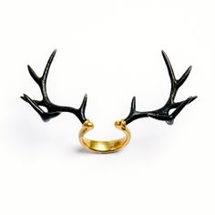 An eye catching piece of jewellery, Antler adjustable ring from our Savage collection, minimalistic design of horn ring that will add an edgy twist to your look. Material: Brass Nickel, cadmium and lead free US Sizes: 8 and can be adjust up to 10 and down to 6 Dimensions: 50mm from side to side Available also in white brass : https://www.etsy.com/uk/listing/874852019/deer-antler-ring-adjustable-ring-bronze?ref=shop_home_active_18 All of our jewellery packed in our labeled gift box For more of ou Deer Antler Ring, Statement Rings Unique, Punk Rock Jewelry, Dark Rings, Fake Gauge Earrings, Horn Ring, Dark Jewelry, Antler Ring, Head Ring