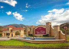 the entrance to villa pelicaa in las vegas, california with mountains in the background