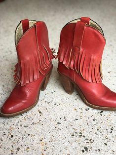 "1970's brick red fringed low height cowboy boots with a great patina by Frye. Estimated Size: US 5.5 Vintage size marked: 6 B Insole: 9\" Width: 3.25\" Heel height: 2.5\" Circa: 1970's Condition: Good vintage condition. Subtle wear, scuffs / marks. SOLD AS-IS. Follow us on Instagram for the latest----> http://instagram.com/closetcasevintage @closetcasevintage Please contact us about any questions you may have regarding condition before purchasing. Read the blog for updates, giveaways and sty Red Western Heeled Boots With Snip Toe, Red Bohemian Boots For Fall, Red Western Heeled Boots With Round Toe, Red Western Style Heeled Boots With Round Toe, Red Heeled Boots For Rodeo In Fall, Red Round Toe Heeled Boots For Rodeo, Red Leather Heeled Boots For Rodeo, Bohemian Red Leather Boots, Vintage Red Boots For Fall